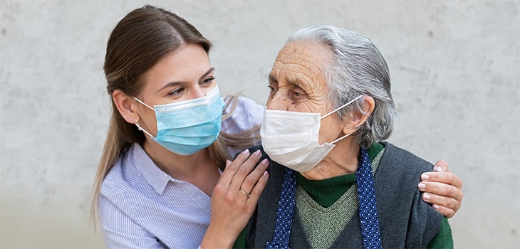 Two Loved Ones Visiting With Masks On